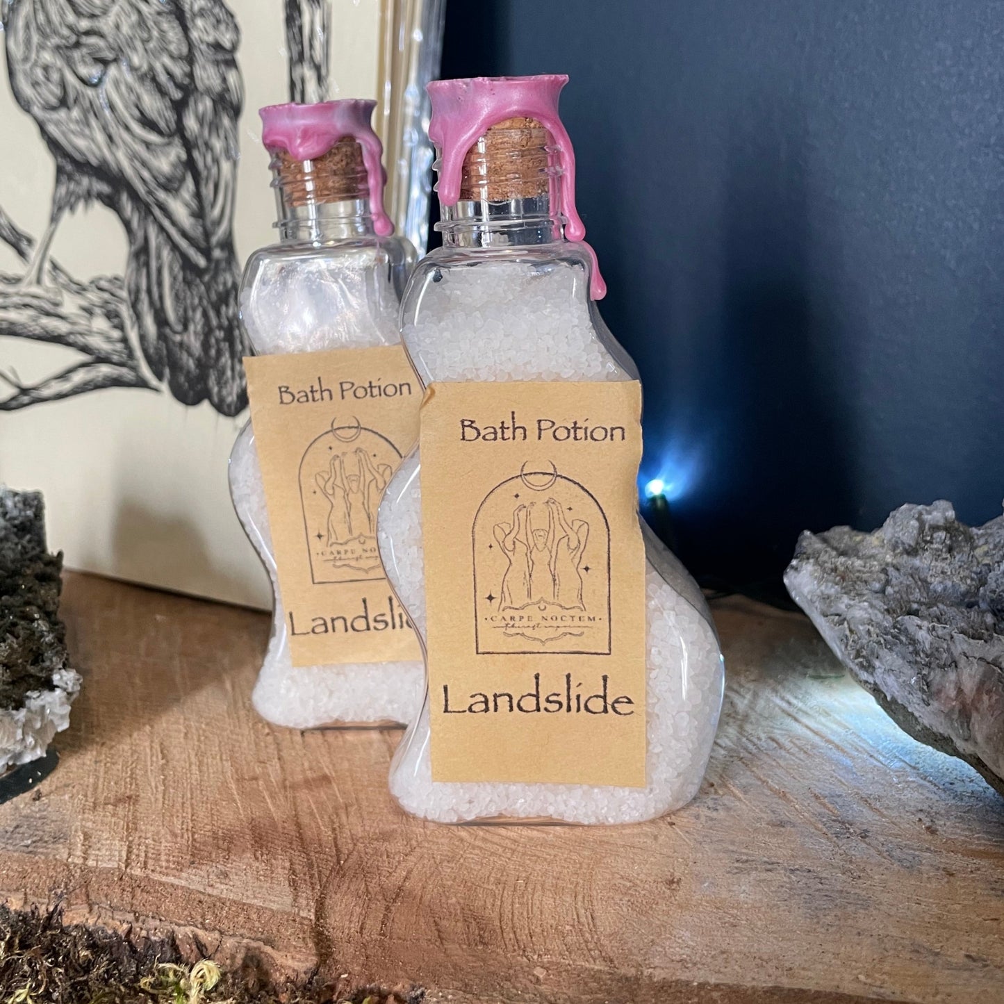 Small bottle with a cork stopper on a wooden surface with a natural background