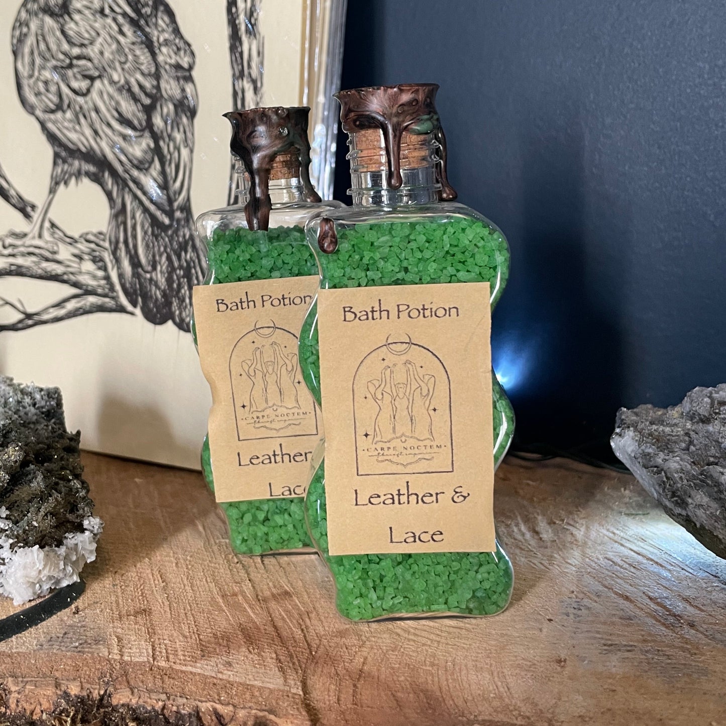 Small leather item with a label on a wooden surface and dark background