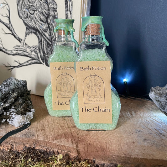 Small bottle with a label on a wooden surface with moss