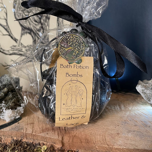 Decorative item with a black ribbon and tag on a natural background