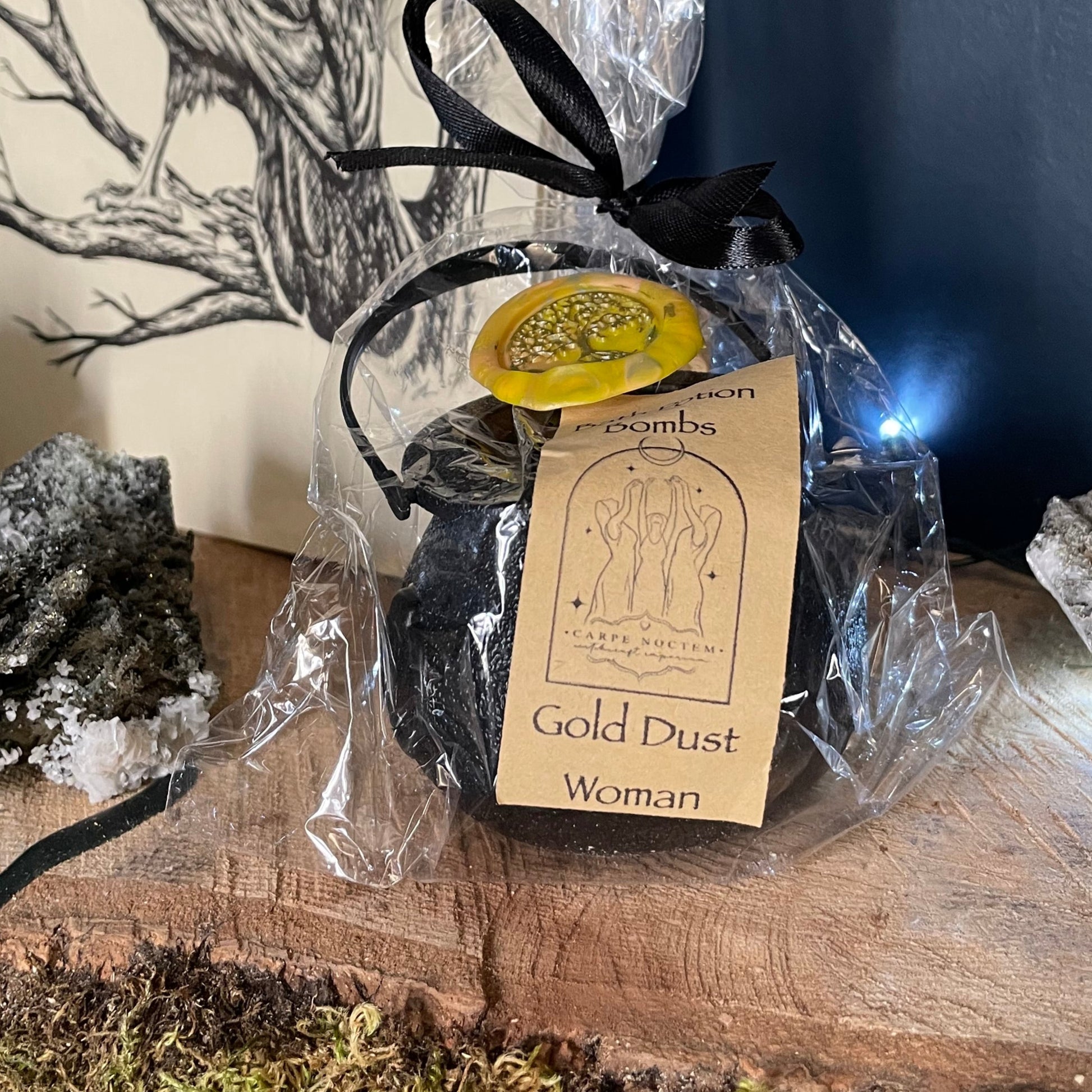 Candle with packaging on a wooden surface with moss